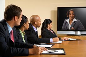 business people watching a presentation on a flat screen